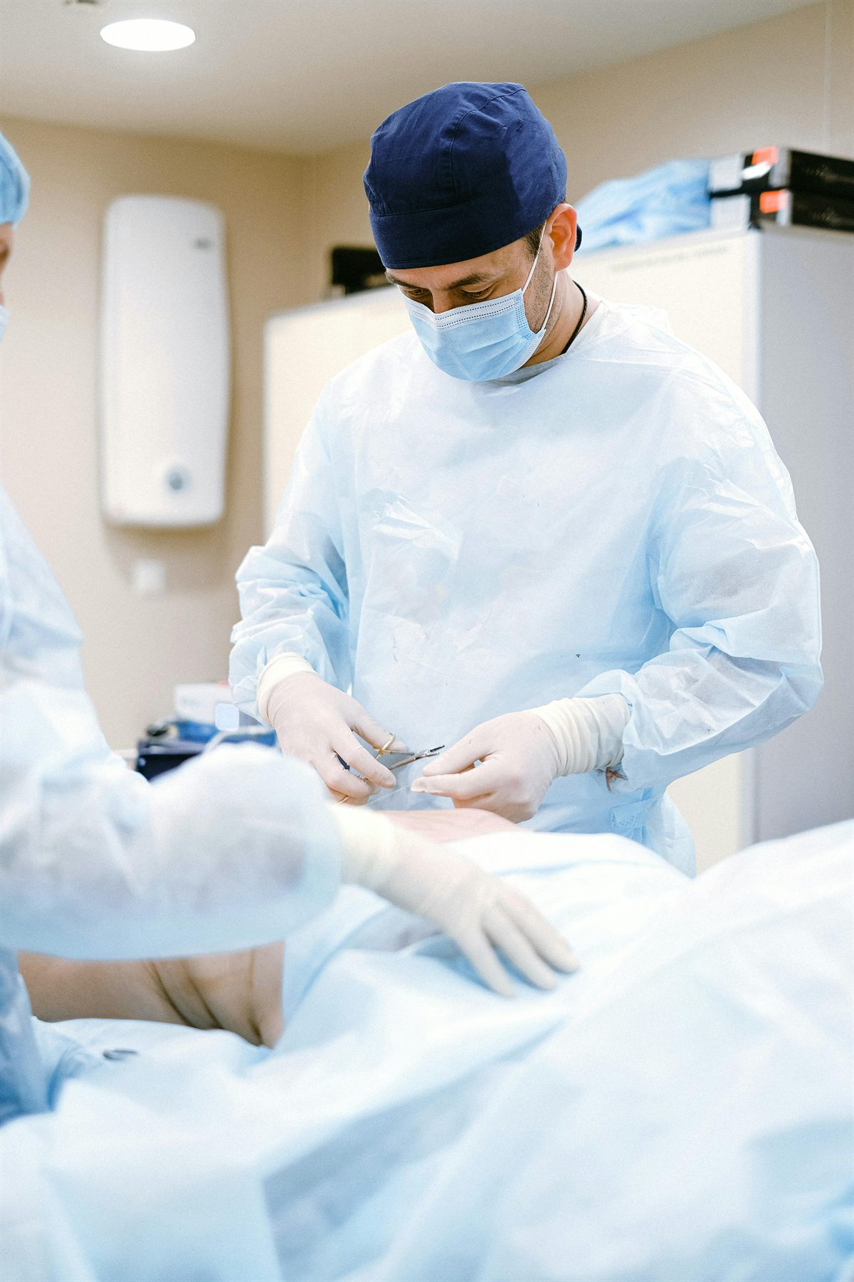 Surgeon preparing for a plastic surgery procedure in an accredited operating suite